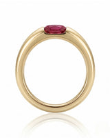 Modern ruby engagement ring with tension set center stone in 18K yellow gold | SARATTI