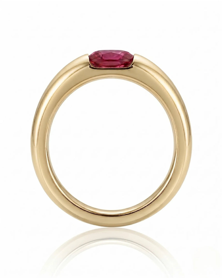 Modern ruby engagement ring with tension set center stone in 18K yellow gold | SARATTI