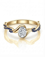 Modern yellow gold moissanite engagement ring with blue sapphire pavé for a meaningful proposal | SARATTI