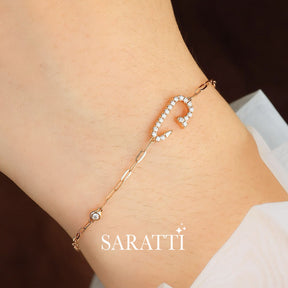 Model wears one dainty Clou Courbé Diamond Bracelet for Women | Saratti 