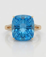 Natural 11.85 carat Swiss Blue topaz ring with ten round diamonds in 18K yellow gold | SARATTI