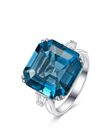 Natural Asscher cut London Blue topaz engagement ring with tapered baguette diamonds in platinum | SARATTI