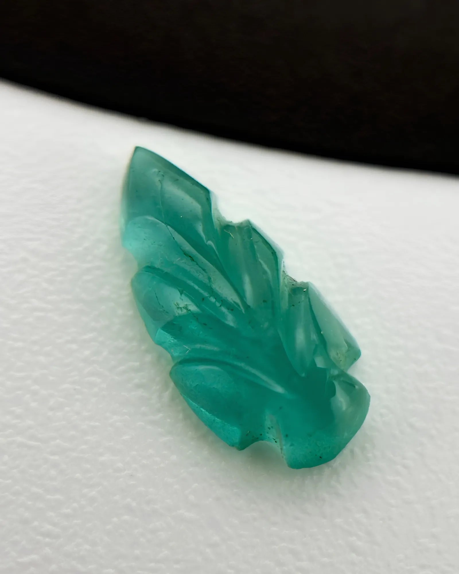 Natural Emerald carved leaf loose gemstones shown from an alternate angle - SARATTI