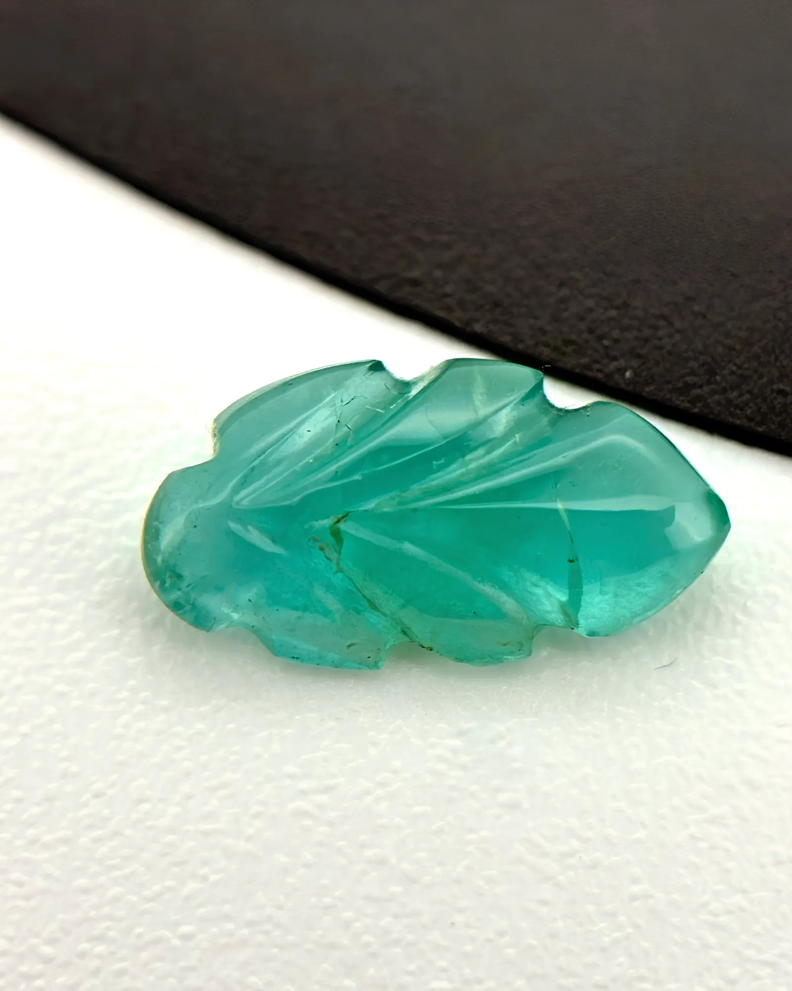 Natural Emerald carved leaf measuring 5 by 9.3 millimetres | SARATTI