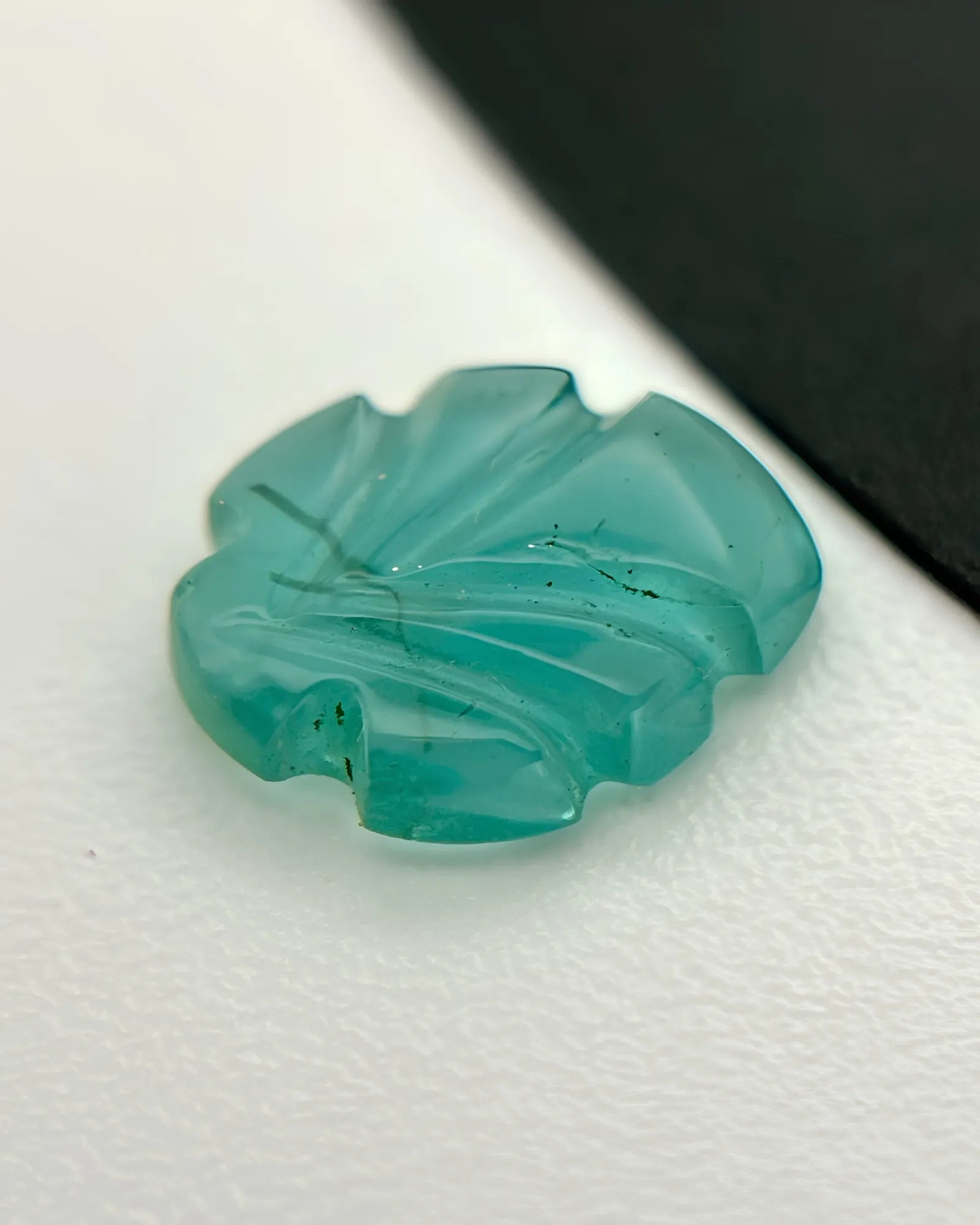 Natural Emerald carved leaf measuring 8 by 6.5 millimetres | SARATTI