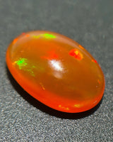 Natural Fire Opal close-up showing warm orange bodycolour and green colour flashes | SARATTI