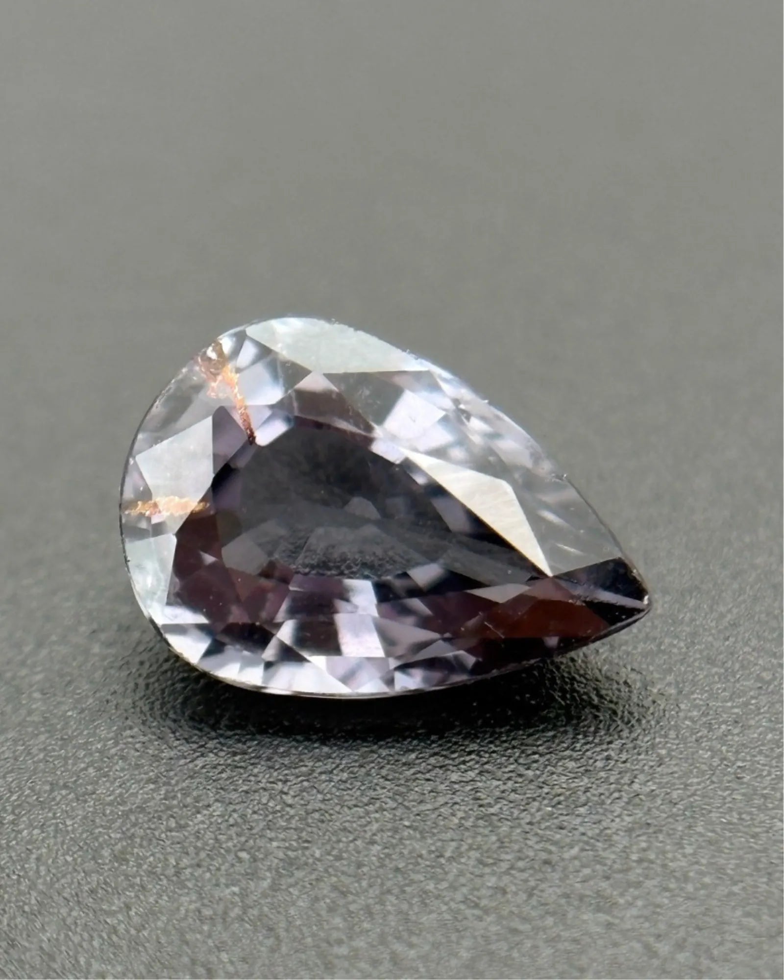 Natural Gray Spinel pear-cut loose gemstone close-up | SARATTI