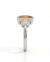 Natural Imperial Topaz oval bezel setting with emerald-cut diamond sides in 18K white gold | SARATTI