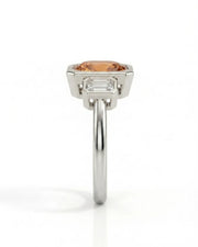 Natural Imperial Topaz oval bezel setting with emerald-cut diamond sides in 18K white gold | SARATTI