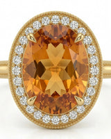 Natural Imperial Topaz oval setting with warm double halo in yellow gold | SARATTI