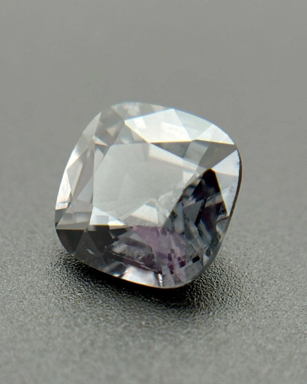 Natural Metallic Gray Spinel cushion-cut loose gemstone close-up | SARATTI