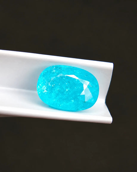Natural Neon Blue Tourmaline 2.75ct oval gemstone close-up with faceted surface | SARATTI