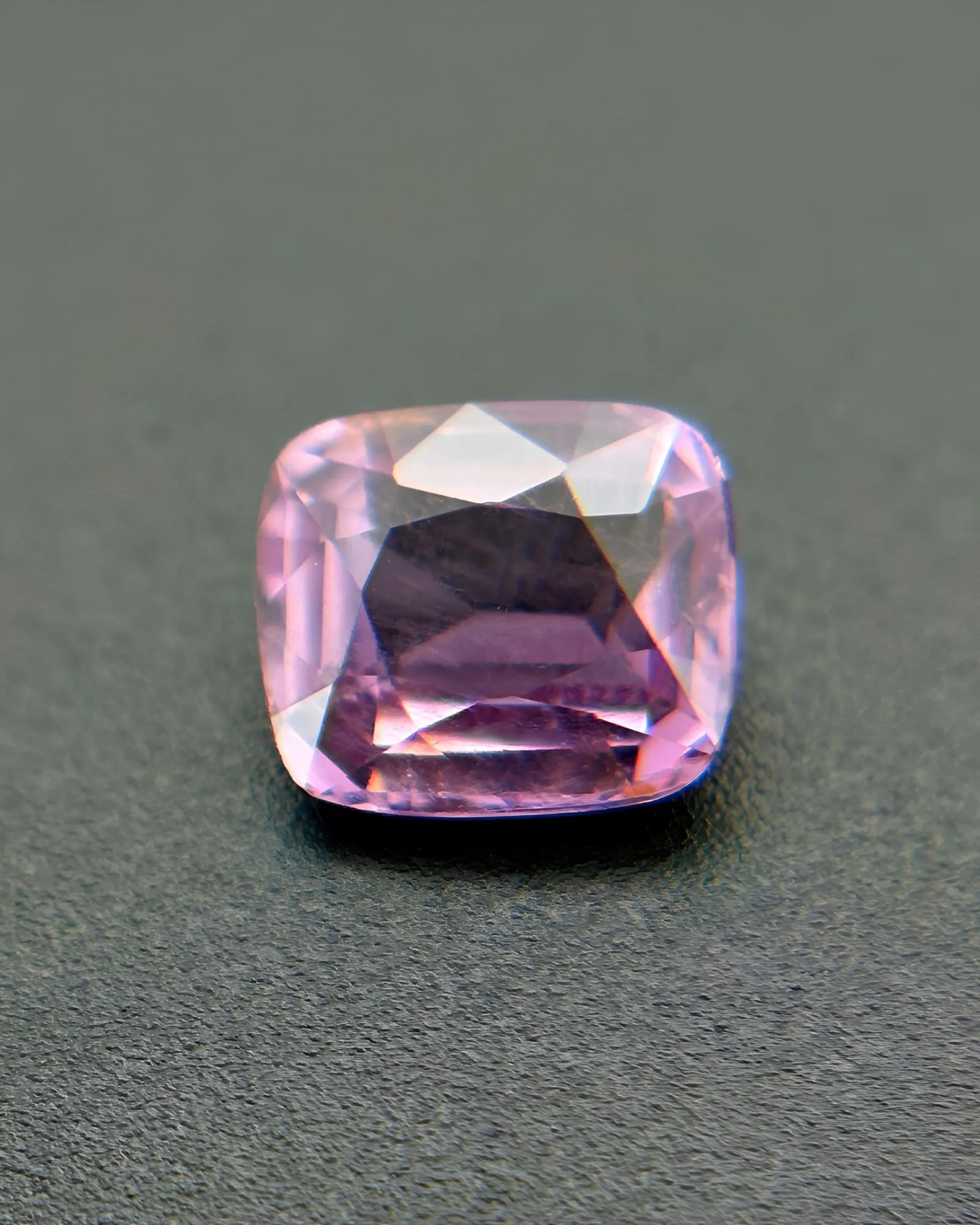 Natural Purplish Spinel cushion-cut loose gemstone close-up | SARATTI