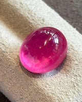 Natural Ruby oval cabochon loose gemstone close-up | SARATTI