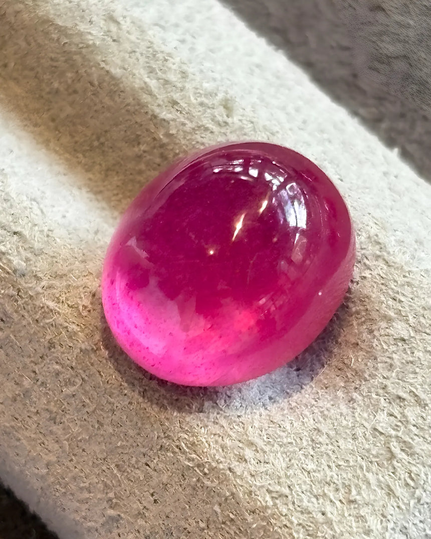 Natural Ruby oval cabochon loose gemstone close-up | SARATTI