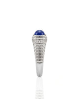 Natural blue sapphire ring with smooth oval cabochon and diamonds in platinum | SARATTI