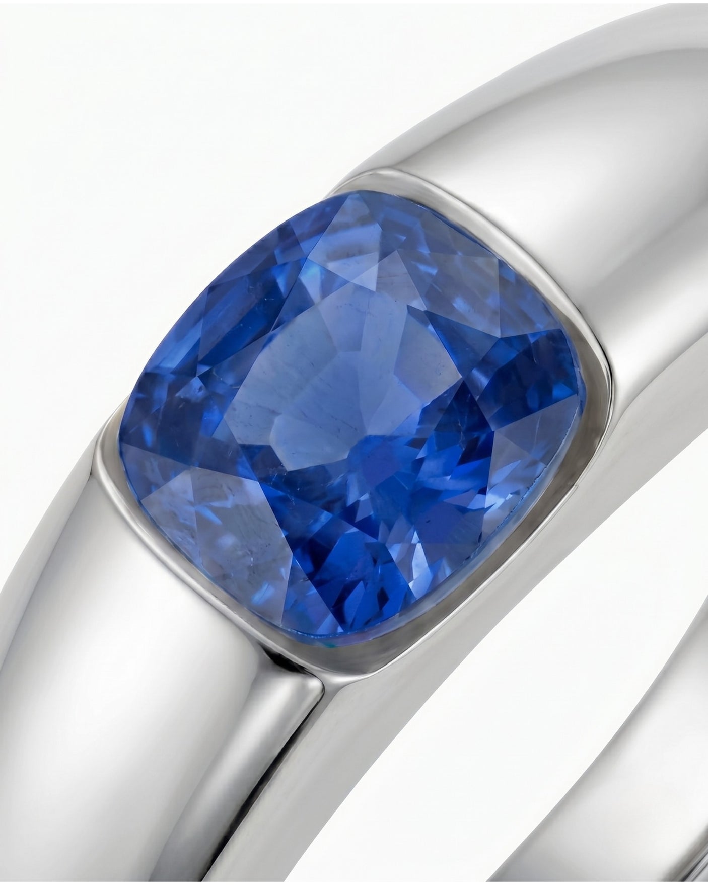 Natural blue sapphire solitaire ring with architectural cushion cut design in platinum | SARATTI