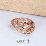 Natural champagne Imperial Topaz pear faceted gemstone top view | SARATTI