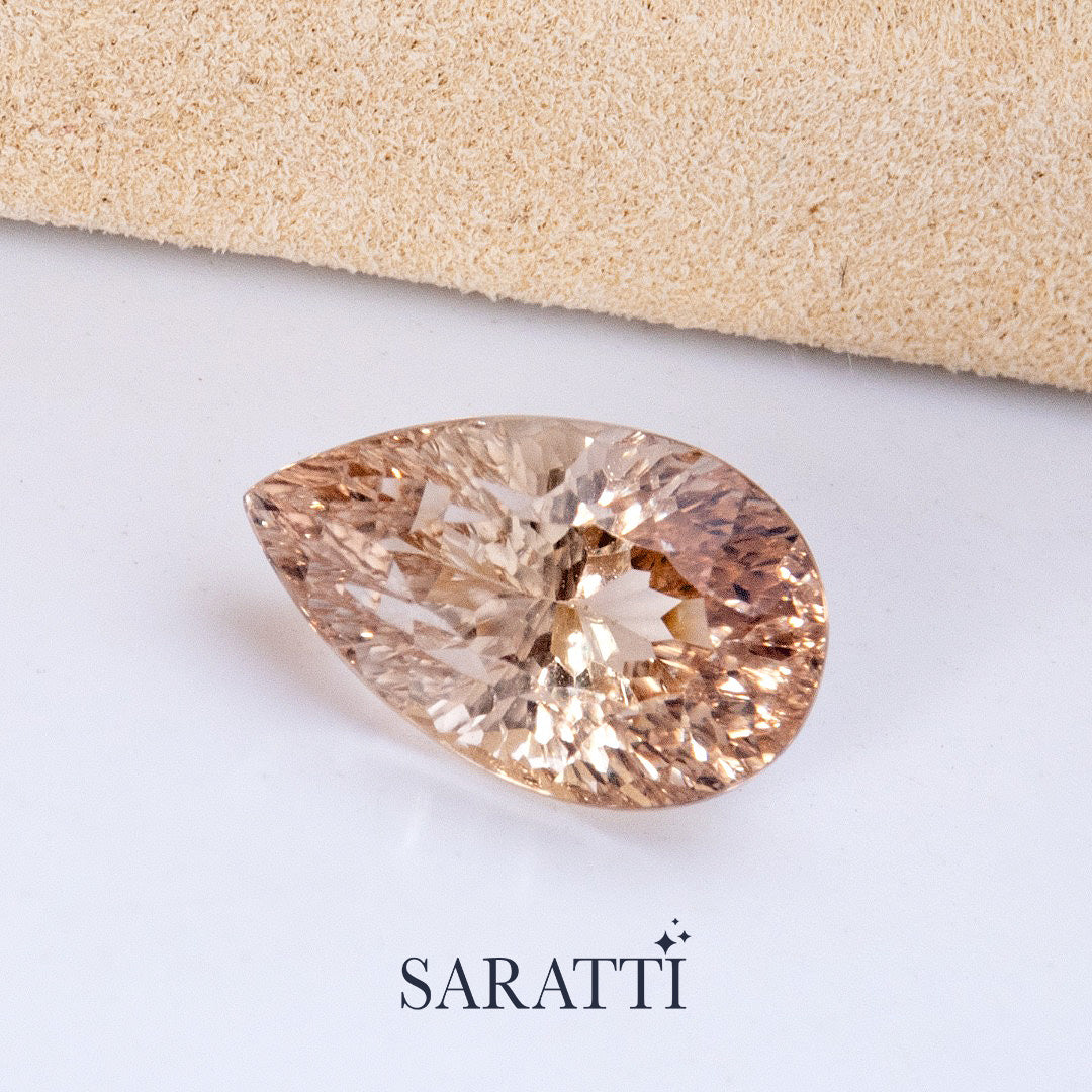 Natural champagne Imperial Topaz pear faceted gemstone top view | SARATTI