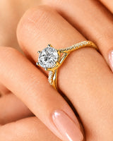 Natural diamond ring with round brilliant center stone and split shank yellow gold band | SARATTI