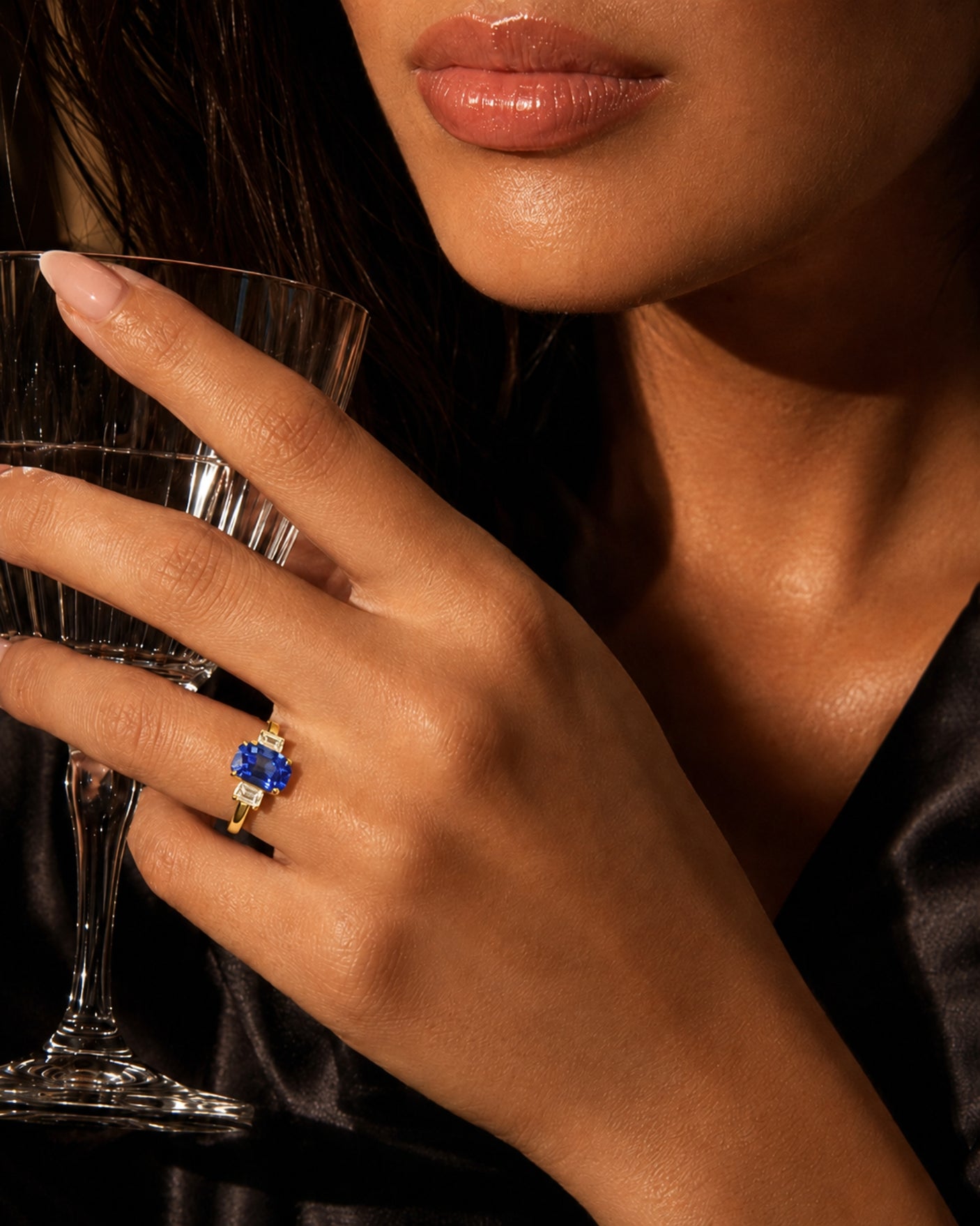 Natural emerald cut sapphire ring with matching diamond side stones in 18K yellow gold | SARATTI