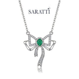 Natural emerald necklace with bow-inspired pendant design | SARATTI

