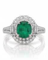 Natural emerald ring with diamond halo and split arc band in 18K white gold | SARATTI