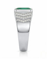 Natural green emerald men’s ring with round diamond side stones in polished platinum | SARATTI
