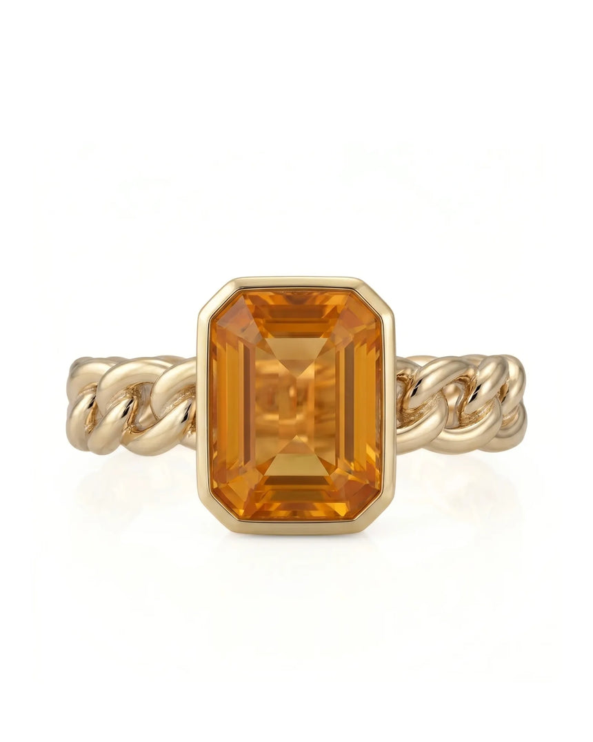 Natural orange sapphire ring with emerald cut center stone in 18K yellow gold | SARATTI