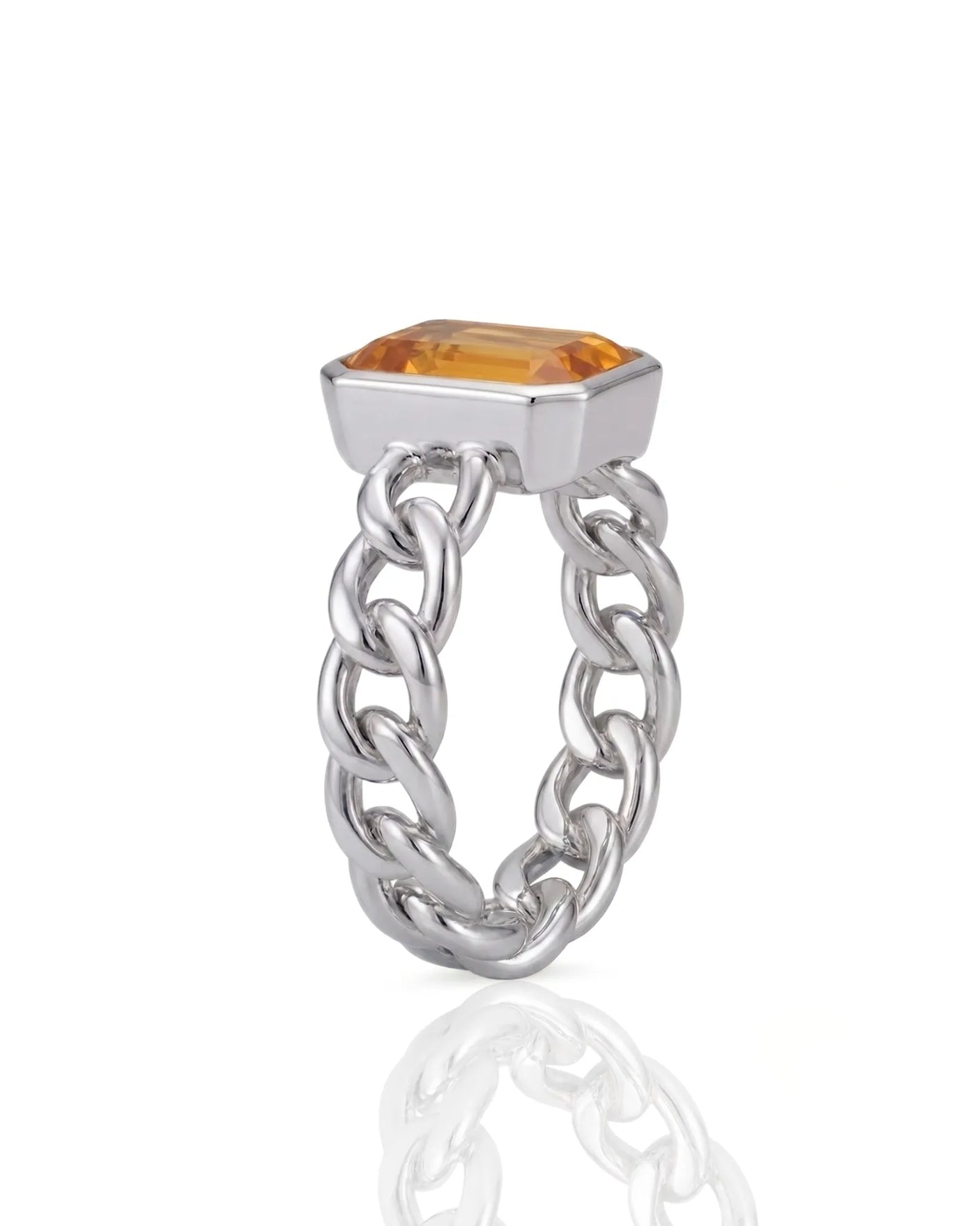 Natural orange sapphire ring with emerald cut center stone in platinum | SARATTI