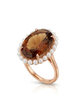Natural oval Imperial Topaz ring surrounded by white pearls in romantic 18K rose gold | SARATTI