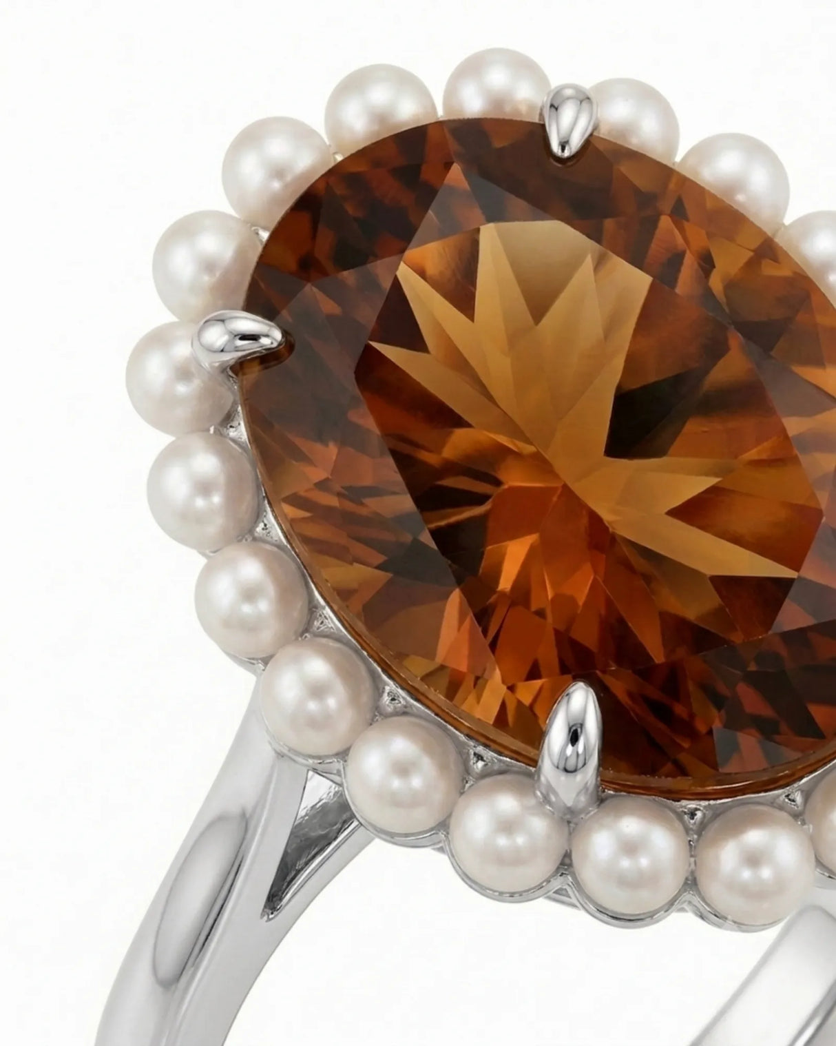 Natural oval Imperial Topaz ring with round pearl halo in enduring polished platinum | SARATTI