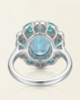Natural oval Swiss Blue topaz ring with apatite and diamond floral halo in 18K white gold - SARATTI