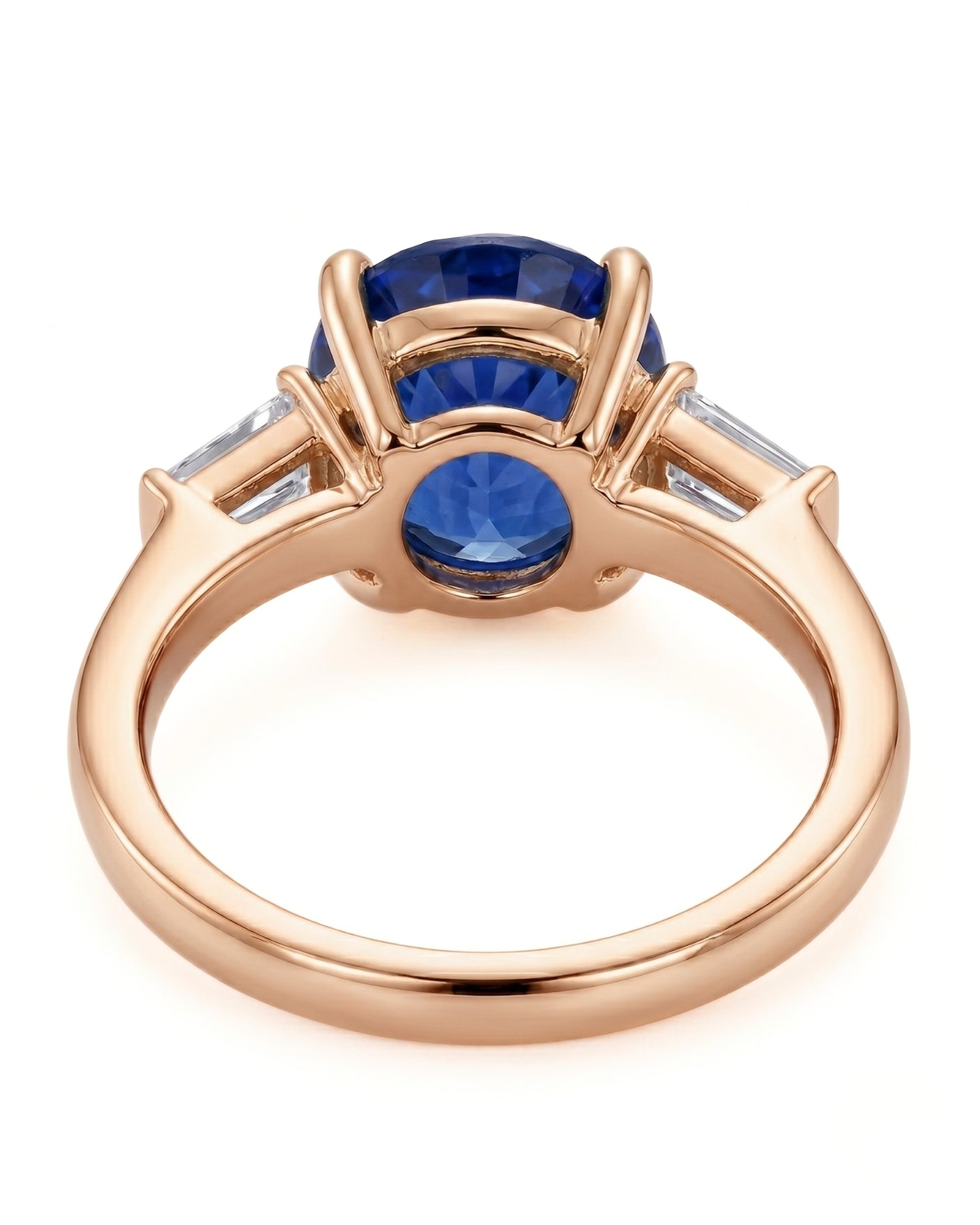 Natural oval blue sapphire ring with side baguette diamonds in 18K rose gold | SARATTI