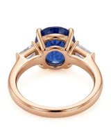 Natural oval blue sapphire ring with side baguette diamonds in 18K rose gold | SARATTI