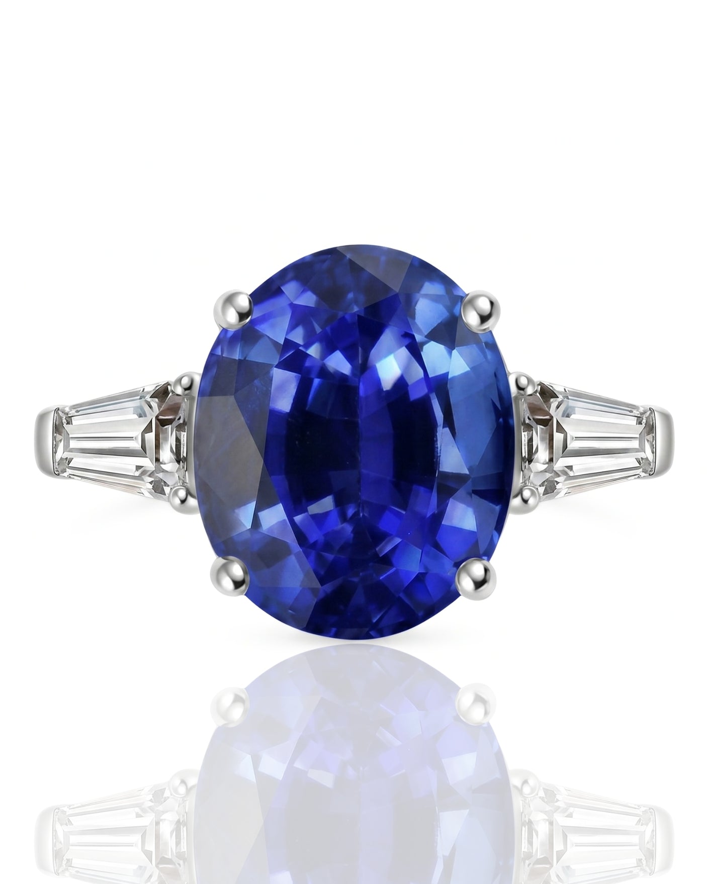 Natural oval blue sapphire ring with side baguette diamonds in polished platinum | SARATTI