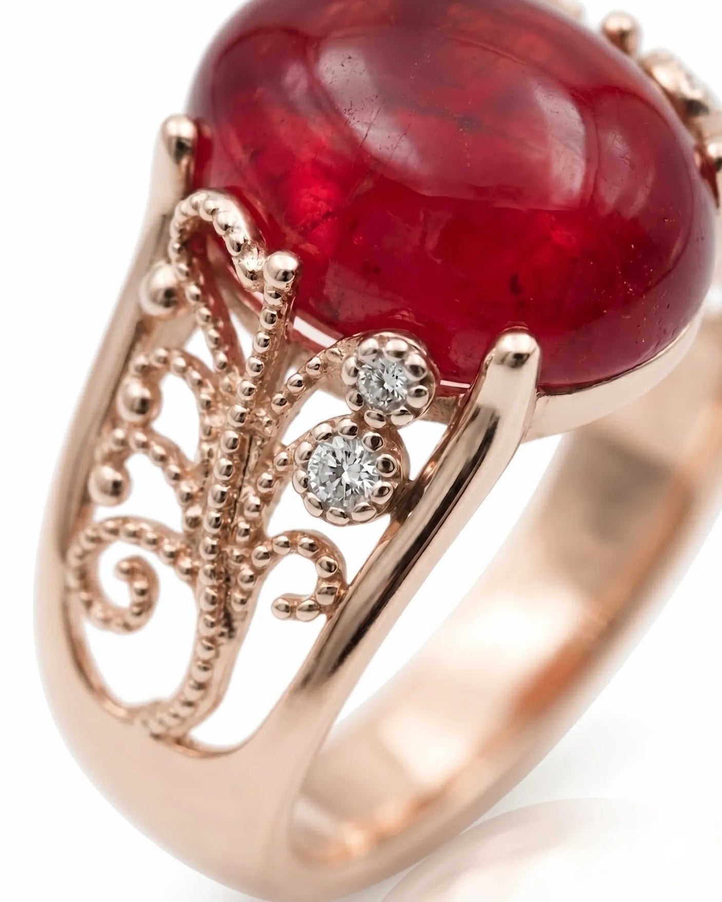 Natural oval cabochon ruby ring with diamond details and romantic rose gold setting | SARATTI