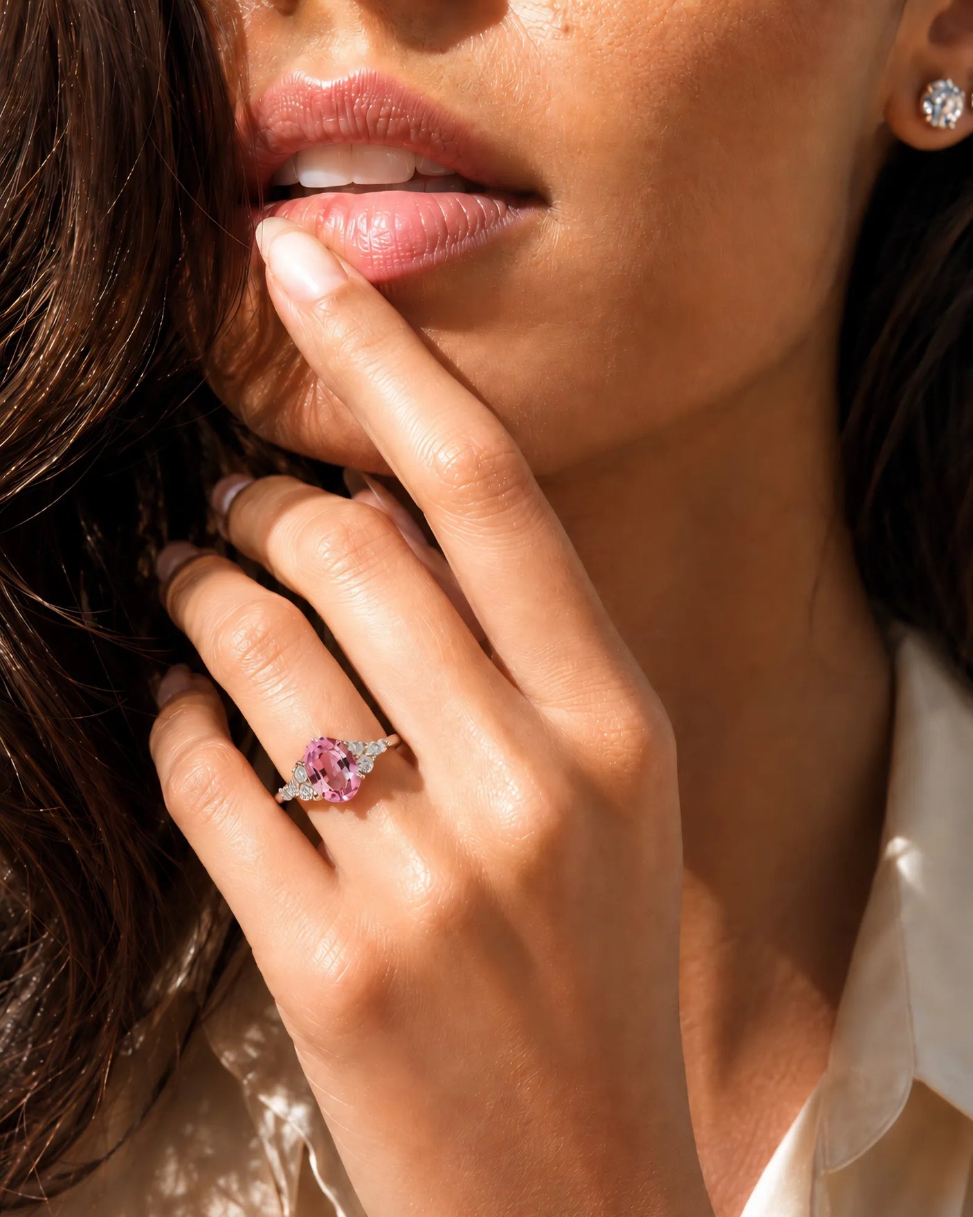 Natural oval pink sapphire ring with sparkling round diamonds in 18K white gold | SARATTI