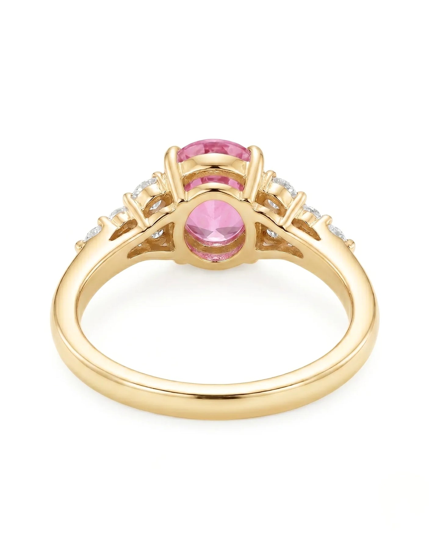 Natural oval pink sapphire ring with sparkling round diamonds in 18K yellow gold | SARATTI