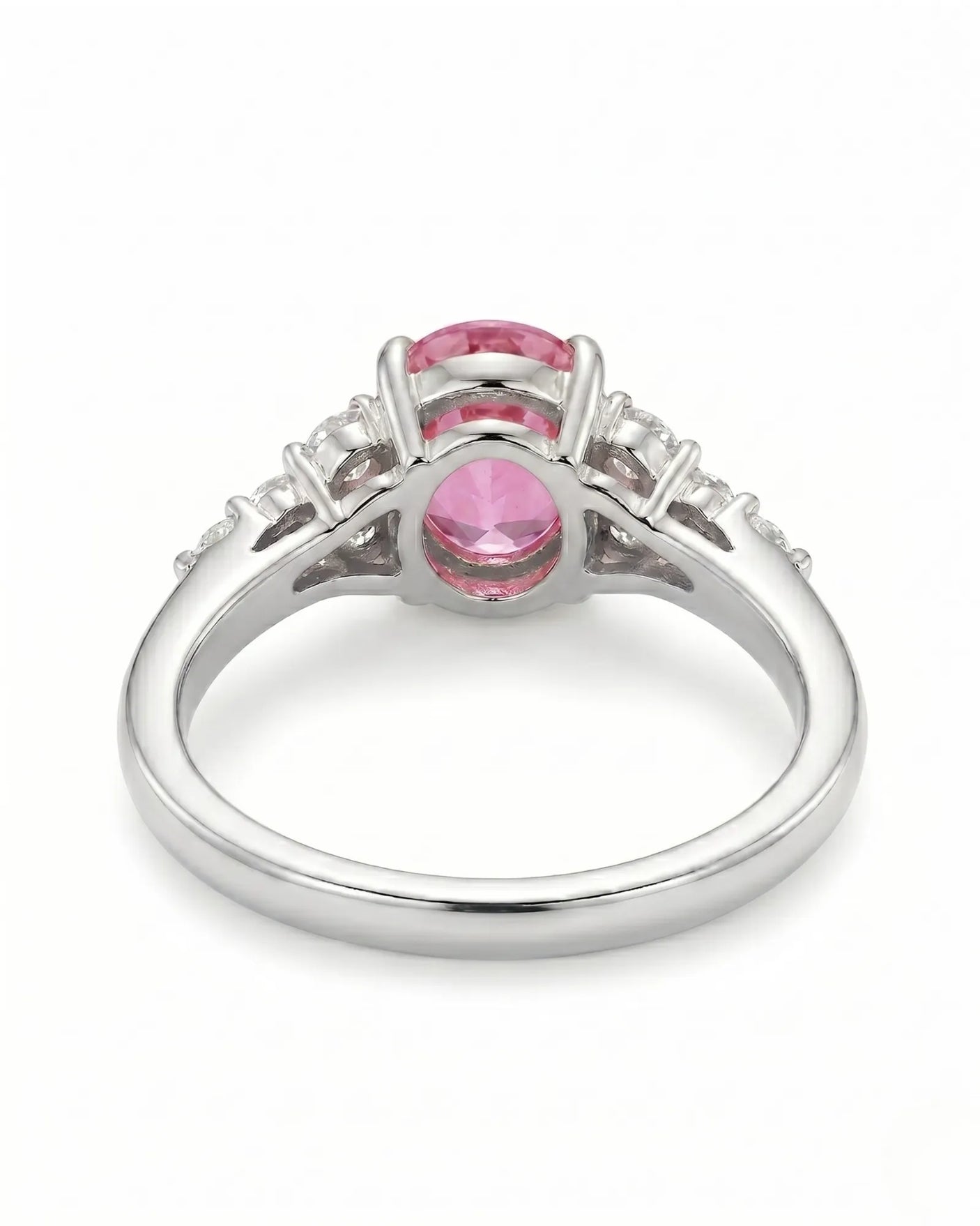 Natural oval pink sapphire ring with sparkling round diamonds in platinum | SARATTI