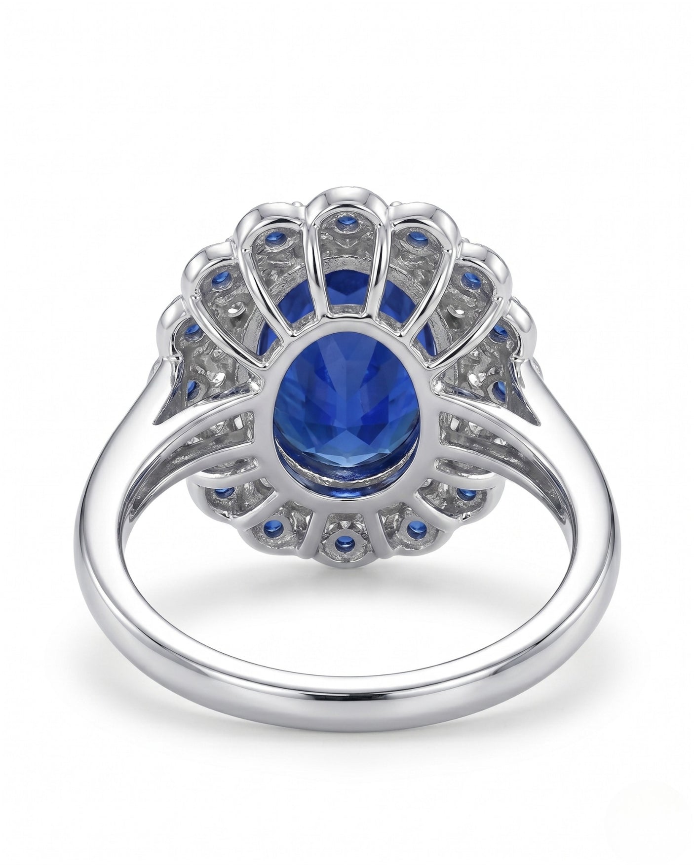 Natural oval royal blue sapphire ring with floral double halo in polished platinum | SARATTI