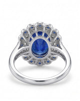 Natural oval royal blue sapphire ring with floral double halo in polished platinum | SARATTI