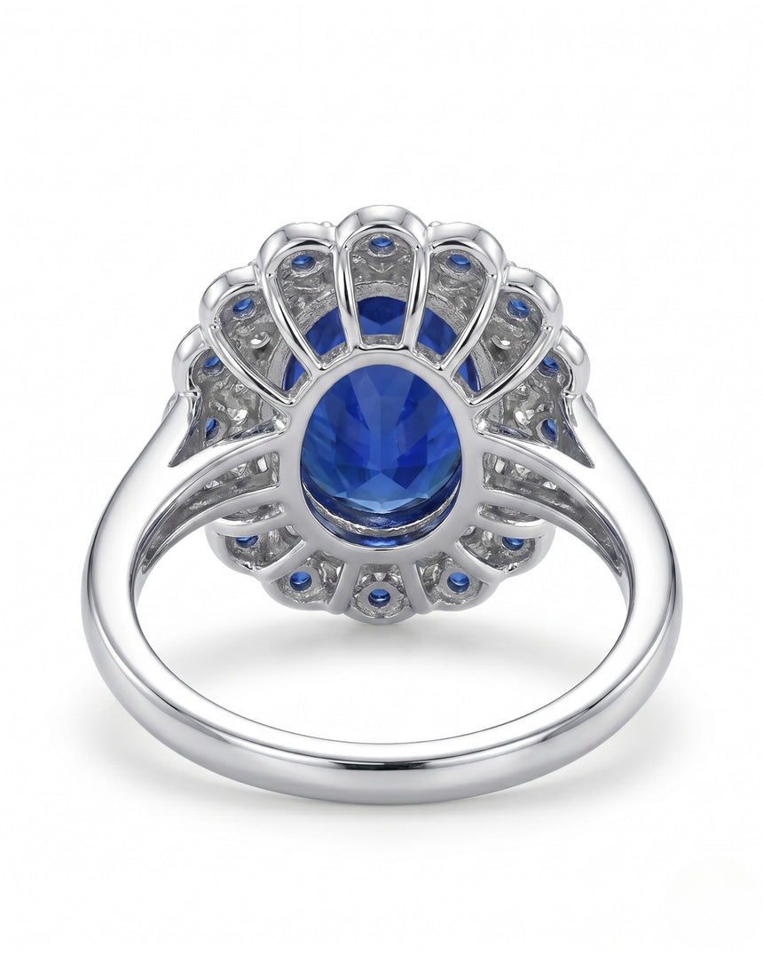 Natural oval royal blue sapphire ring with floral double halo in polished platinum | SARATTI