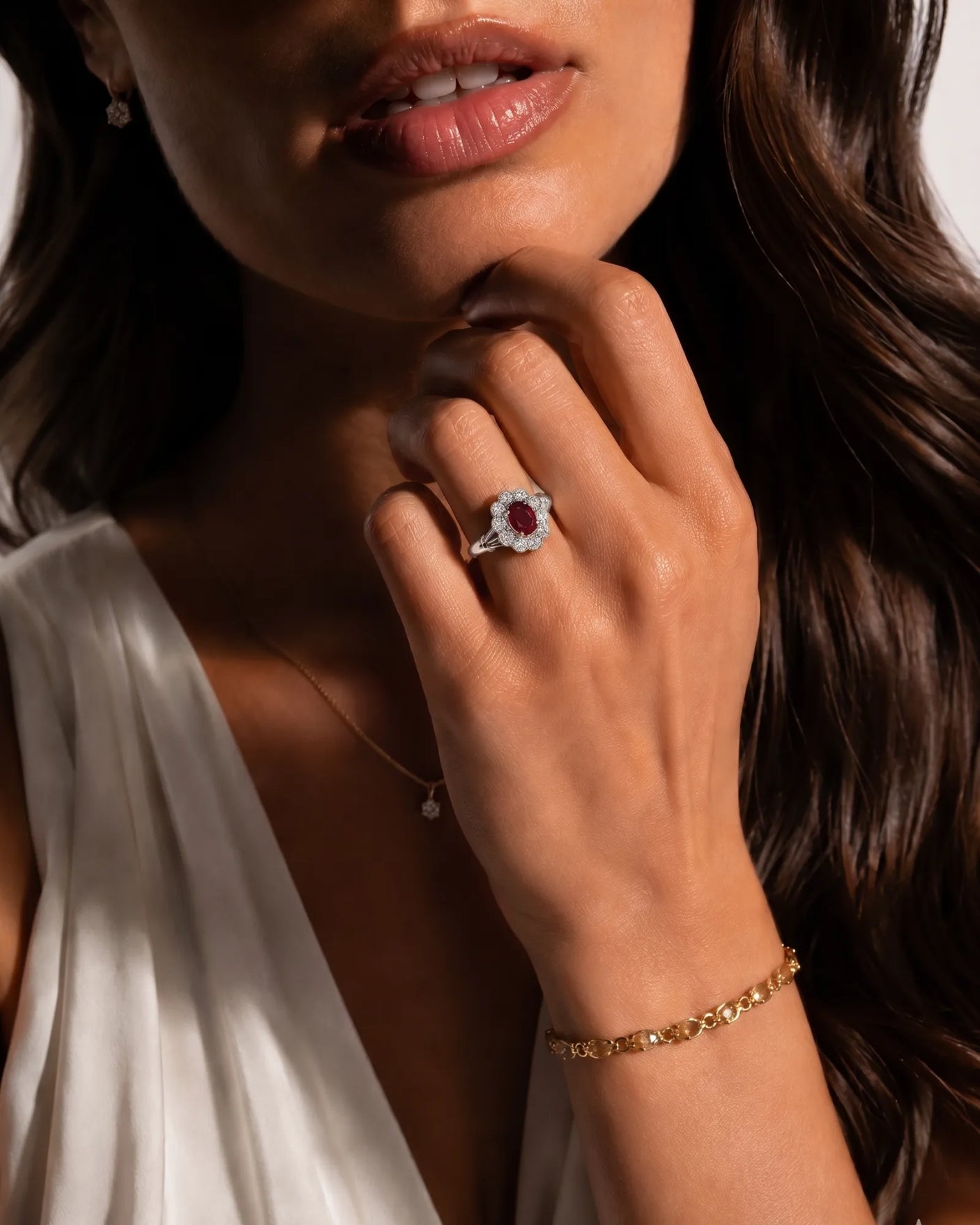 Natural oval ruby ring with brilliant diamonds and baguette side stones | SARATTI