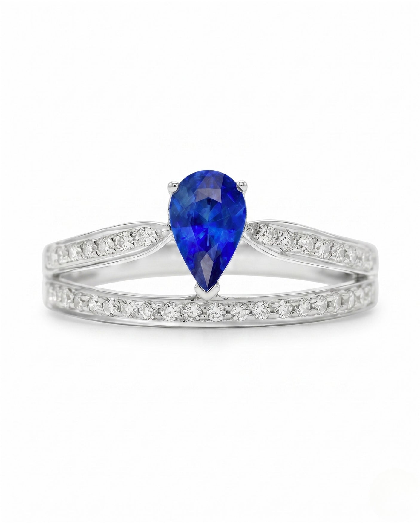 Natural pear blue sapphire ring with round diamond accents in 18K white gold | SARATTI