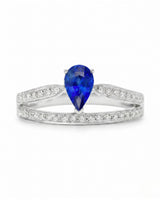 Natural pear blue sapphire ring with round diamond accents in 18K white gold | SARATTI