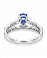 Natural pear blue sapphire ring with round diamond accents in polished platinum | SARATTI