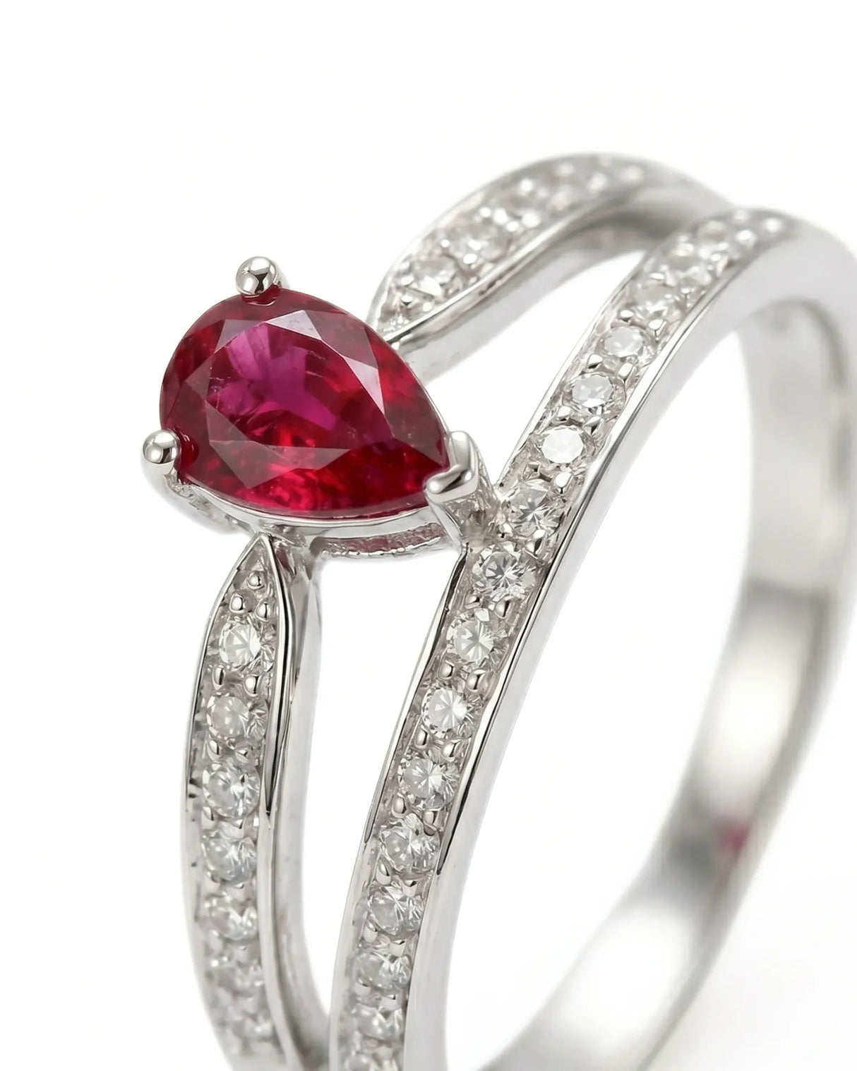 Natural pear ruby ring with pavé diamond accents and polished platinum setting | SARATTI