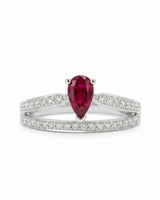 Natural pear ruby ring with pavé diamond accents and white gold setting | SARATTI