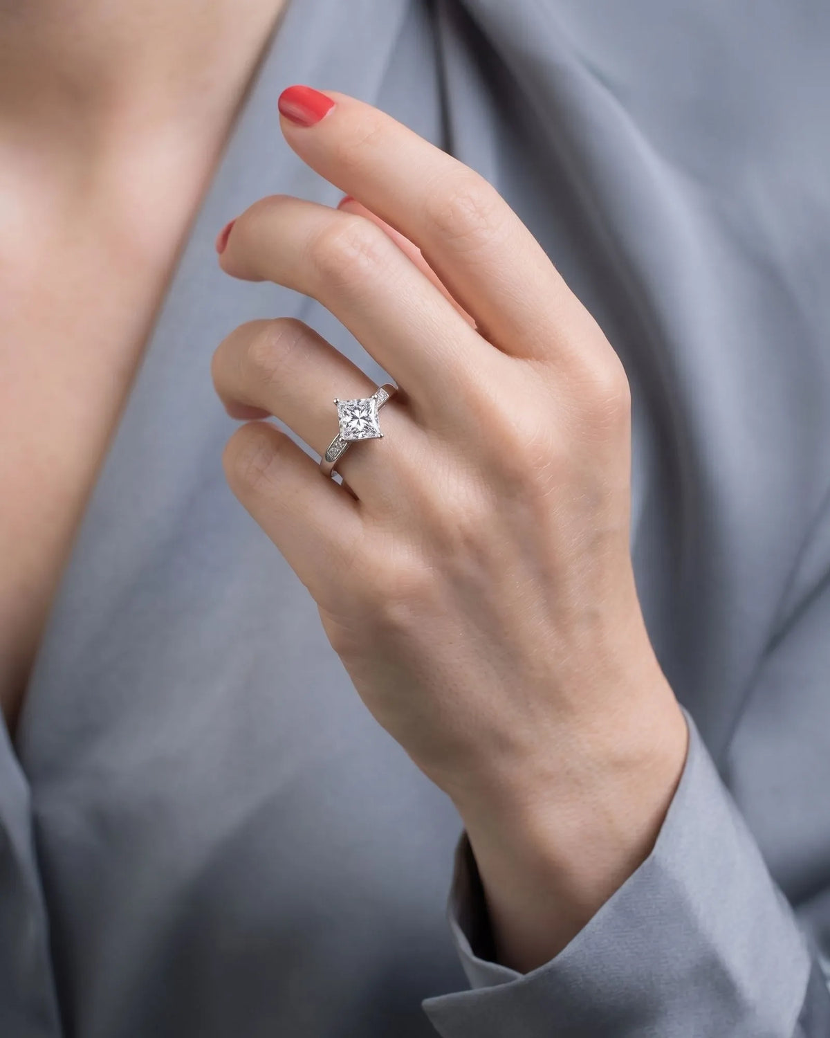 Natural princess cut diamond ring top view with diamond-set shoulders in platinum | SARATTI
